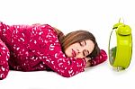 Sleeping Girl With Clock Stock Photo