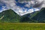 Slovenia Slovenja Beautiful Landscape, Green Mountains And Blue Cloud Sky Stock Photo