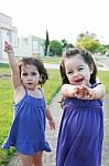 Small Little Girls Standing Stock Photo