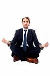 Smart Businessman Doing Meditation Stock Photo