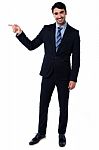 Smart Businessman Pointing At Something Stock Photo