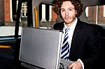 Smart Confident Young Businessman With Suitcase Stock Photo