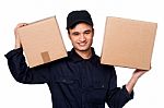 Smart Courier Boy Delivering Parcels Stock Photo