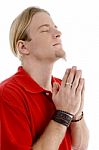 Smart Young Male Praying To God Stock Photo