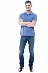 Smart Young Man With Crossed Arms Stock Photo