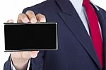Smartphone On Businessman Hand Stock Photo