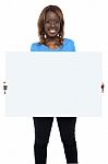 Smiling African Girl Holding Board Stock Photo