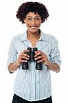 Smiling Afro American Woman Holding Binocular Stock Photo