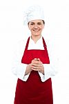 Smiling Aged Female Chef Standing Stock Photo