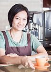 Smiling Asian Barista   Posing With Cup Of Coffee Stock Photo