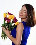 Smiling Brunette With Tulips Stock Photo