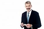 Smiling Businessman With Cellphone Stock Photo