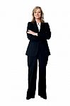 Smiling Businesswoman Arms Crossed Stock Photo