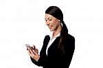 Smiling Businesswoman Using Mobile Phone Stock Photo