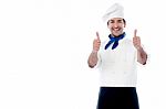 Smiling Chef Showing Double Thumbs Up Stock Photo