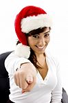 Smiling Christmas Lady Pointing Stock Photo
