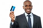 Smiling Corporate Guy Showing Credit Card Stock Photo