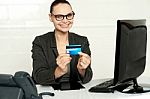 Smiling Corporate Lady Showing Credit Card Stock Photo