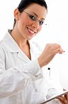 Smiling Doctor Holding Clipboard Stock Photo