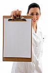 Smiling Doctor Showing clipboard Stock Photo