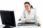 Smiling Doctor Working In Computer Stock Photo
