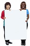 Smiling Friends Holding Blank Board Stock Photo