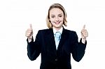 Smiling Girl Gesturing Double Thumbs Up Stock Photo