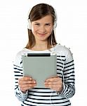 Smiling Girl Holding I-pad Stock Photo