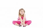 Smiling Girl Sitting On Floor Stock Photo