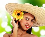 Smiling Girl Wearing Straw Hat Stock Photo