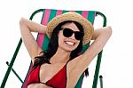 Smiling Gorgeous Bikini Model In Dark Shades Stock Photo