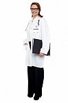 Smiling Lady Doctor With Medical File In Hand Stock Photo