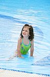 Smiling Little Girl Swimming Stock Photo