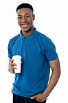 Smiling Man Holding Cold Beverage Stock Photo