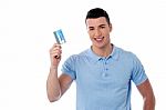 Smiling Man Holding Credit Card Stock Photo