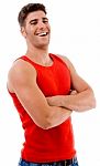 Smiling Muscular Man Posing With Crossed Arms Stock Photo
