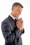 Smiling Praying Businessman Stock Photo