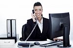 Smiling Woman Busy Over Phone Stock Photo