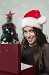 Smiling Woman Holding Gift Box Stock Photo