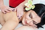 Smiling Woman Relaxing During Back Massage At Spa Stock Photo