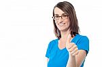 Smiling Woman Showing Thumbs Up Gesture Stock Photo