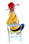 Smiling Woman Sitting On Chair Stock Photo