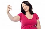 Smiling Woman Taking A Selfie Stock Photo