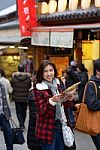 Smiling Woman Tourist Hold Map Stock Photo