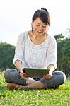 Smiling Woman With Digital Tablet Stock Photo