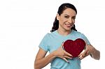 Smiling Woman With Heart Shape Gift Box Stock Photo