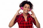 Smiling Woman With Pink Headphones On Stock Photo
