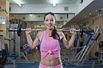 Smiling Women With Barbells In Gym Stock Photo