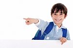 Smiling Young Boy Pointing Stock Photo