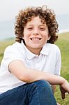 Smiling Young Boy Posing Casually Stock Photo